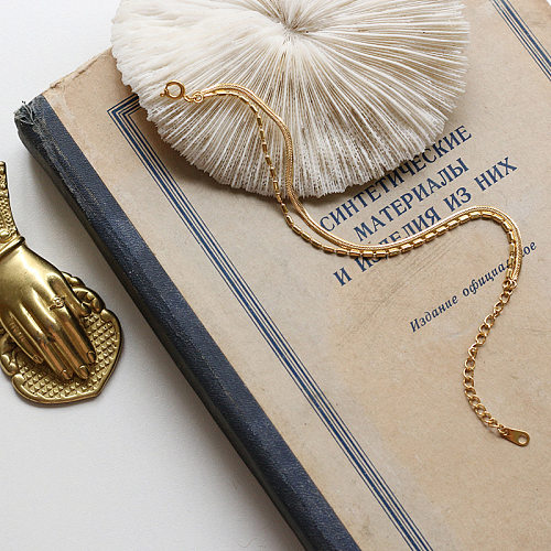 Einfache Schlangenknochen-Perlenkette aus Titanstahl mit 18-karätigem Gold überzogenes Armband. Großhandelsschmuck