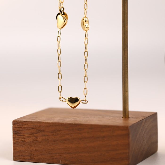 Collier pendentif plaqué or 18 carats en acier inoxydable en forme de cœur de style simple