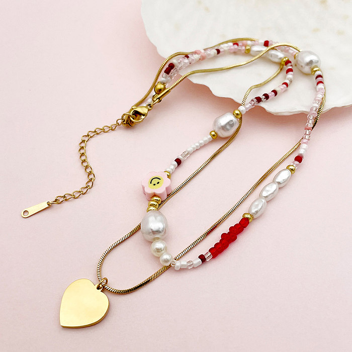 Elegante, herzförmige, doppellagige Halsketten aus Edelstahl mit Perlen und Emaille-Beschichtung, vergoldet