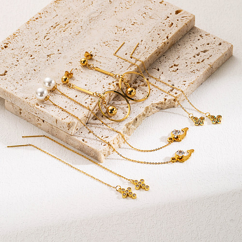 1 par de pendientes colgantes chapados en oro con incrustaciones de circonita y mariposa cruzada elegante de acero inoxidable