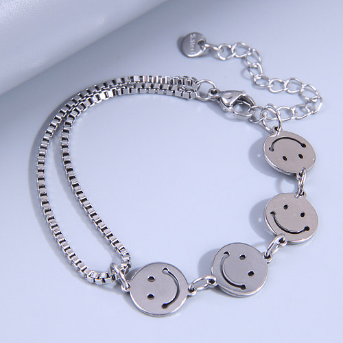 Bracelets asymétriques en acier inoxydable avec visage souriant de style simple