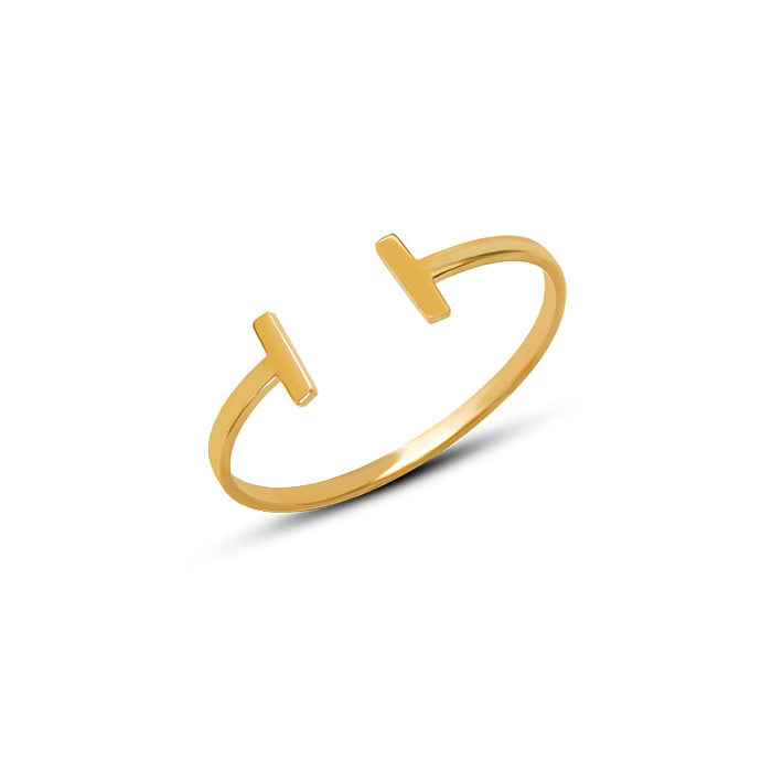 Bracelet ouvert en forme de T de géométrie de mode en acier au titane en or 18 carats