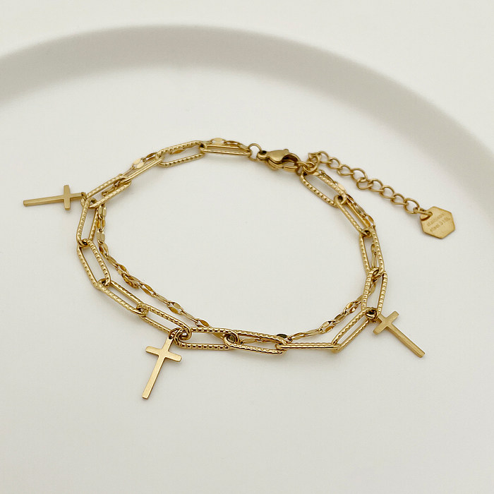 Estilo moderno estilo simples cruz pulseiras banhadas a ouro em aço inoxidável