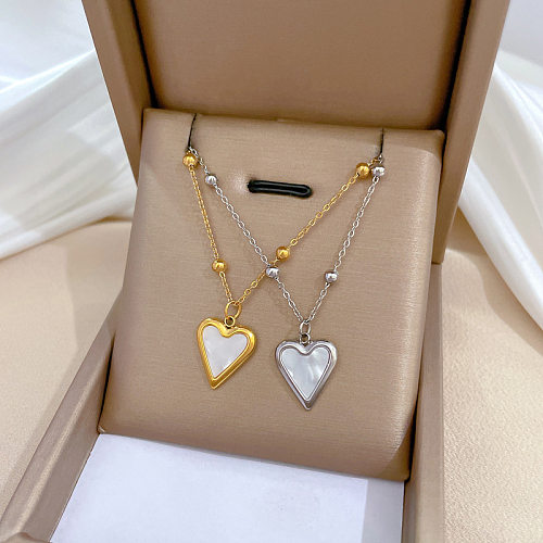 Collier pendentif plaqué or en acier inoxydable en forme de cœur pour dame