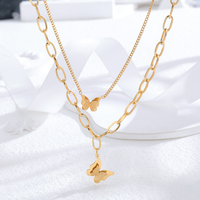Venta al por mayor, collar de diamantes de imitación chapado en oro de 24K de acero inoxidable con mariposa en forma de corazón y borla de estilo vintage