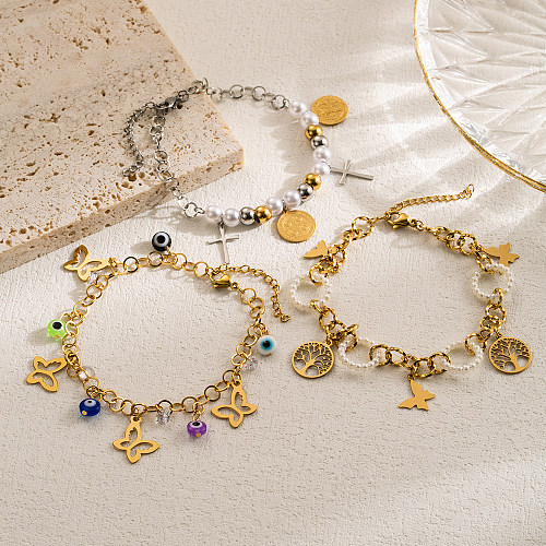 Pulseras chapadas en oro con capas de perlas de imitación de acero inoxidable, mariposa, ojo del diablo, cruz artística informal