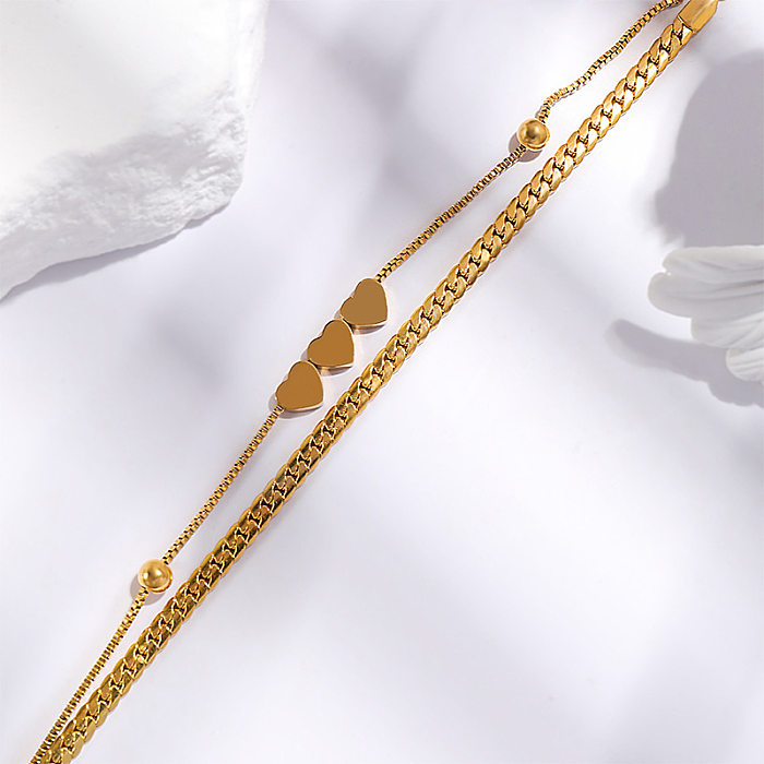 Elegante, schlichte, herzförmige Armbänder mit Titanstahlbeschichtung und 18-Karat-Vergoldung