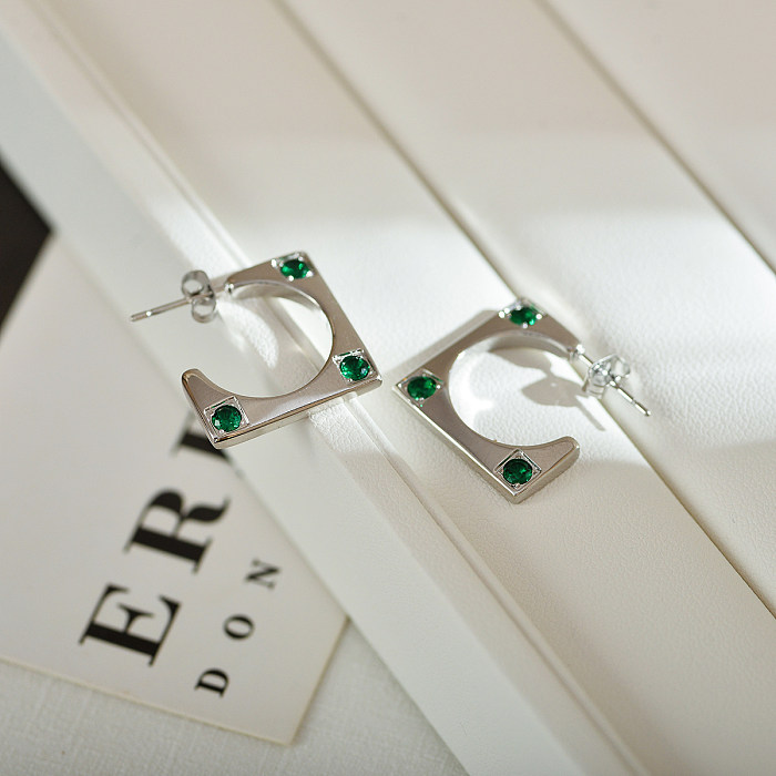 1 paire de clous d'oreilles plaqués or 18 carats, style streetwear simple, incrustation carrée en acier inoxydable et zircon