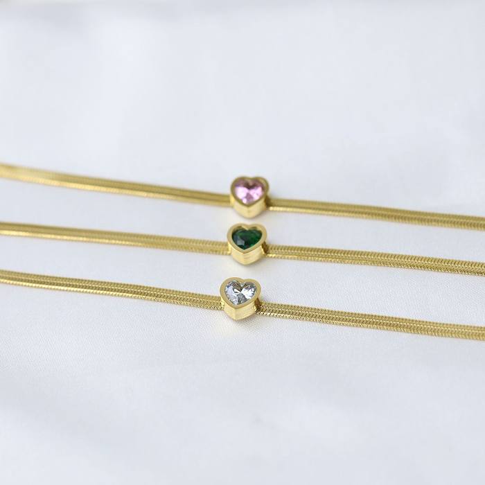 Pulseiras de strass artificiais banhadas a ouro em aço titânio em forma de coração estilo simples