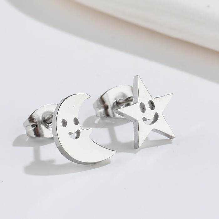 1 paire de clous d'oreilles ajourés en acier inoxydable, ailes d'étoile et de lune, placage asymétrique, à la mode