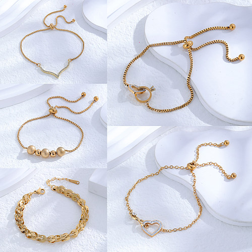 Glänzende, runde, herzförmige Armbänder im klassischen Stil mit Titanstahlbeschichtung und Inlay aus Zirkon mit 24-Karat-Vergoldung