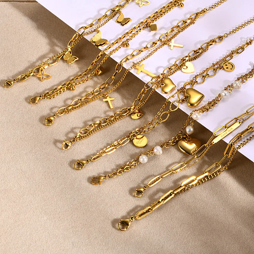 Einfache Schmetterlingsarmbänder aus Edelstahl mit 18 Karat vergoldeten Perlen