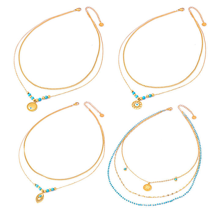 Mehrschichtige Halsketten im Ethno-Stil mit Teufelsauge und Intarsien aus Edelstahl mit türkisvergoldeter Vergoldung