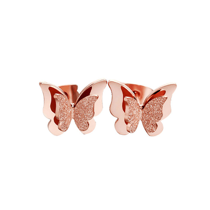 Pendientes de mariposa chapados en acero inoxidable con mariposa de estilo simple a la moda