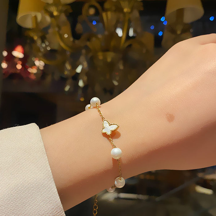 Pulseras de concha de perlas artificiales con incrustaciones de acero titanio mariposa en forma de corazón estrella de moda