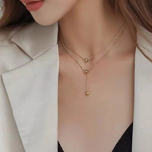 Collier de perles rondes Double couche pour femme, sens créatif du pompon assorti, collier court en acier inoxydable