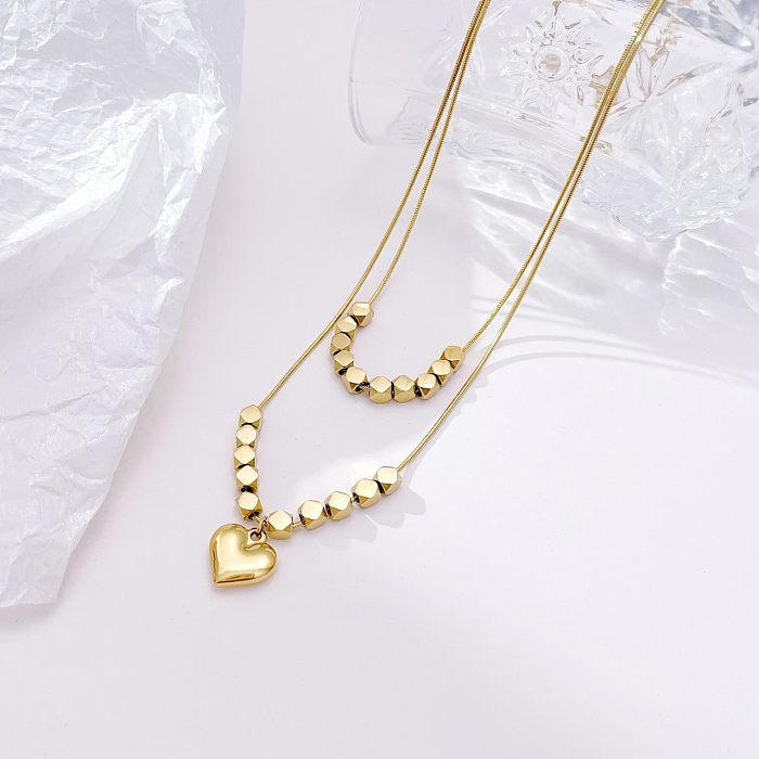 Colar de pingente banhado a ouro de aço inoxidável em forma de coração de estilo simples a granel