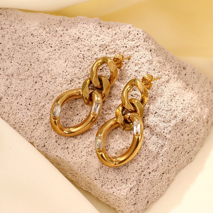 1 par de pendientes chapados en oro con circonitas de acero inoxidable con incrustaciones rectangulares irregulares elegantes