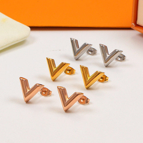 1 paire de clous d'oreilles en acier inoxydable plaqué lettres pour femme élégante