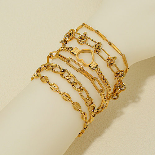 Bracelets plaqués or en acier titane en forme de cœur avec vagues de style simple