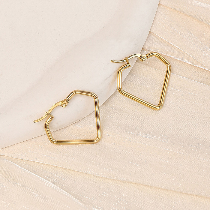 1 par de pendientes de aro chapados en oro de acero inoxidable con forma de corazón y estrella de estilo sencillo