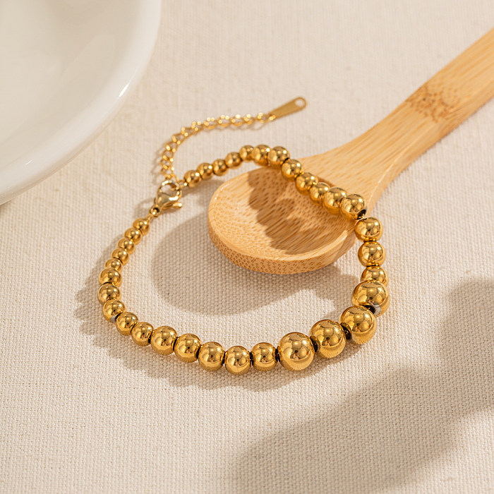 Commute Runde Armbänder aus Edelstahl mit Perlenbeschichtung und 18-Karat-Vergoldung
