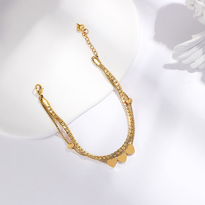 Bracelets plaqués or 18 carats en acier titane en forme de coeur de style simple élégant