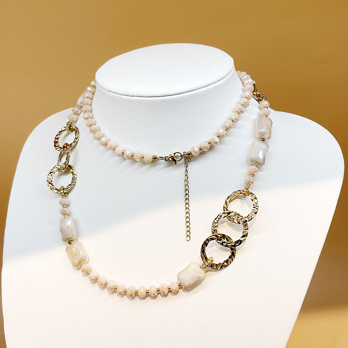 Glamouröse, moderne Halskette mit rundem, rechteckigem Edelstahl-Kristall und vergoldeter Metallbeschichtung