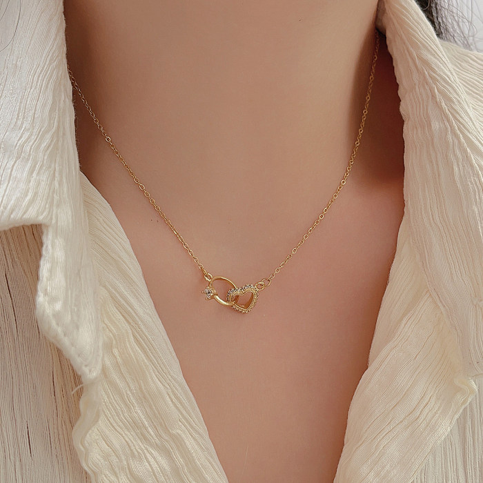 Collar chapado en oro de circón con incrustaciones de acero inoxidable con cola de pez en forma de corazón de estilo simple