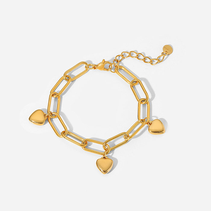 Bracelet à chaîne croisée avec pendentif à trois cœurs plaqué or 18 carats en acier inoxydable de style rétro