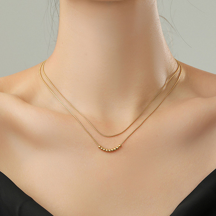 Collar chapado en oro de 14 quilates con borlas de cobre y acero inoxidable de color sólido de estilo simple
