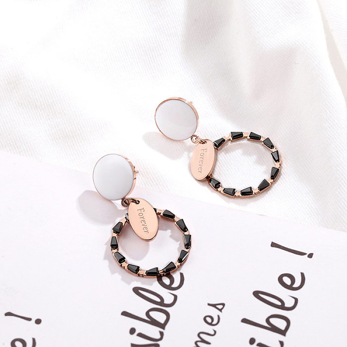 1 paire de boucles d'oreilles rondes plaquées en acier inoxydable pour femme