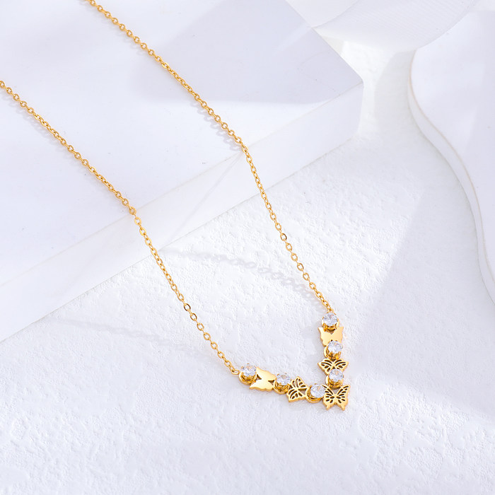 Venta al por mayor, collar de diamantes de imitación chapado en oro de 24K de acero inoxidable con mariposa en forma de corazón y borla de estilo vintage