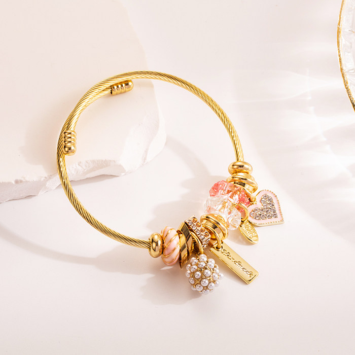 Elegantes pulseras chapadas en oro con incrustaciones de acero y titanio con diamantes de imitación en forma de corazón y luna dulce