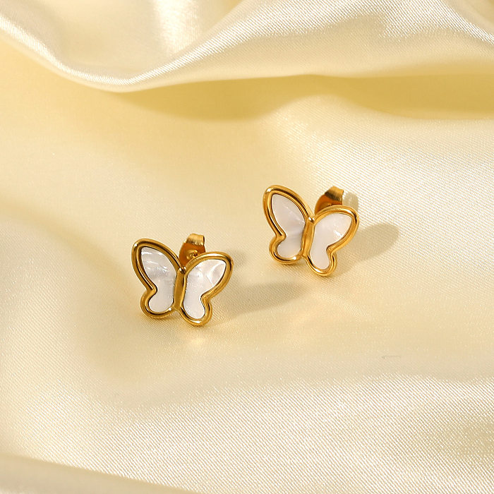 Modischer Ohrstecker aus 18-karätigem Gold mit natürlicher weißer Muschel und Schmetterlingsform aus Edelstahl