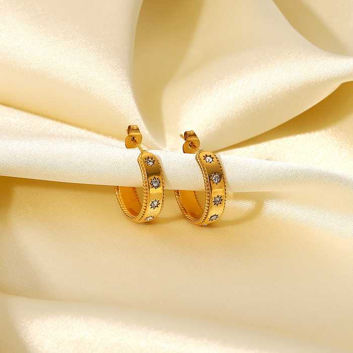 Modische Ohrringe aus 18-karätigem Gold mit eingelegtem Sternzirkon und schlichtem Edelstahl