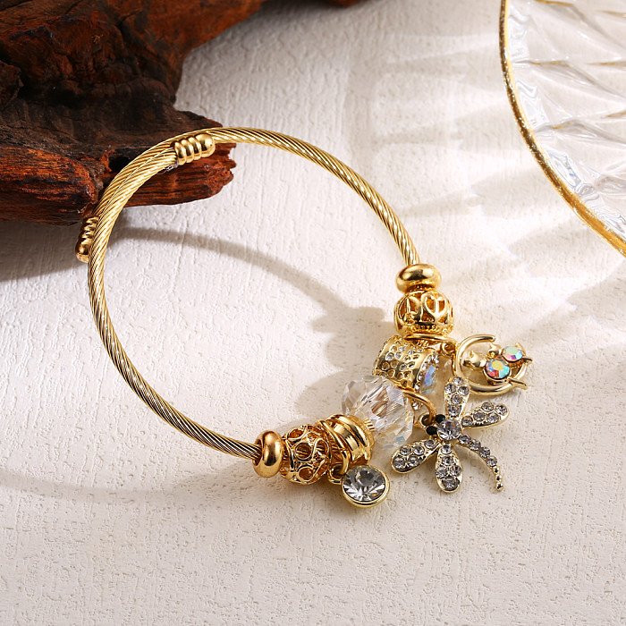 Eleganter, süßer, herzförmiger Libellen-Schmetterlings-Armreif aus Edelstahllegierung mit Perleneinlage und Strasssteinen