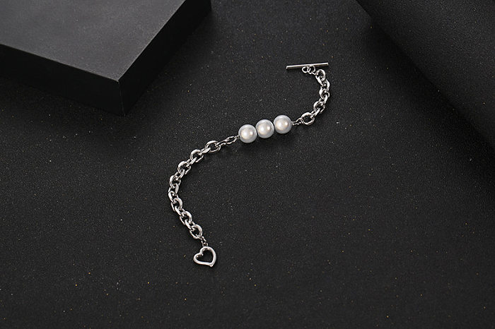 Pulseras de perlas de acero titanio con forma de corazón estilo fresco estilo IG