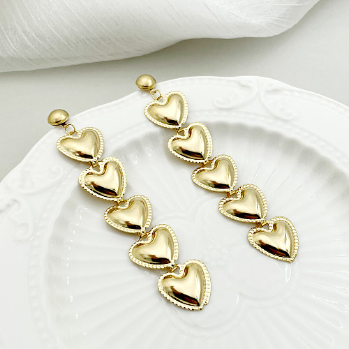 1 paire de boucles d'oreilles pendantes en forme de cœur exagérée en acier inoxydable plaqué or