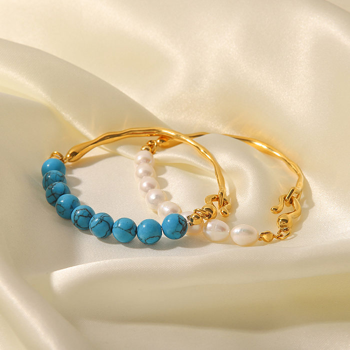 Luxuriöse geometrische Edelstahl-Armbänder mit vergoldeten türkisfarbenen Perlen