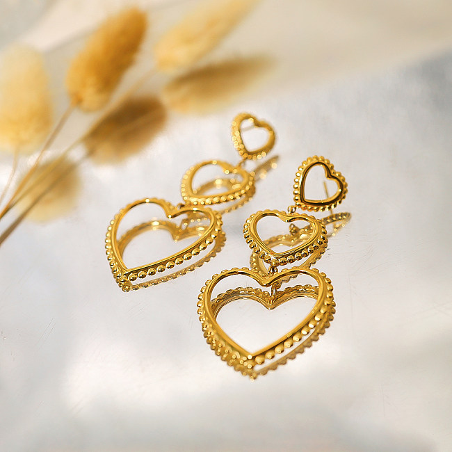 1 par de pendientes colgantes chapados en oro de 18 quilates de acero inoxidable huecos chapados en forma de corazón estilo francés de vacaciones estilo IG