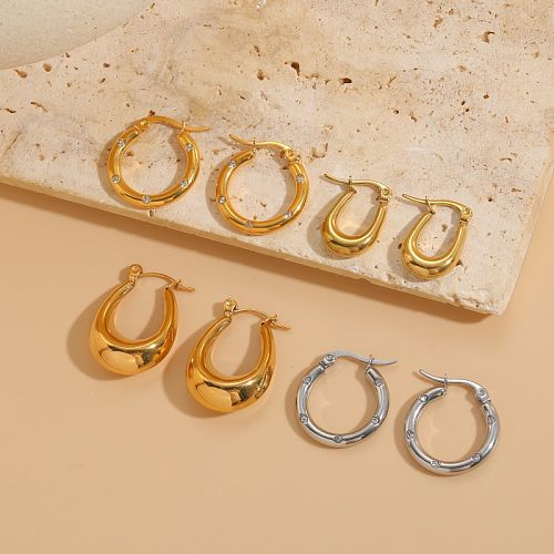 1 par de elegantes pendientes chapados en oro de 14 quilates con forma de C y forma de U con incrustaciones asimétricas de acero inoxidable