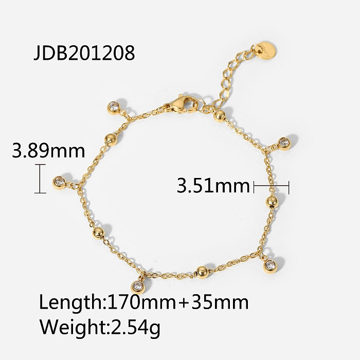 Bracelet en acier inoxydable plaqué or 14 carats avec cinq petits pompons en zircon