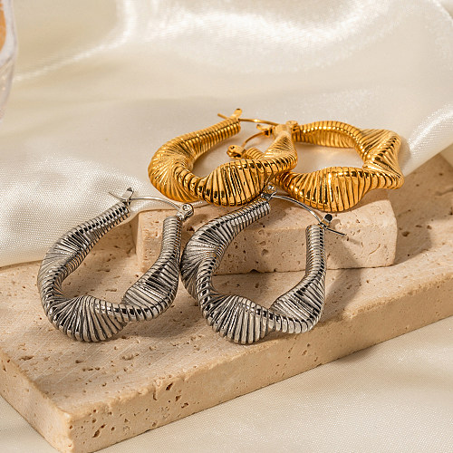 1 par de pendientes de aro chapados en oro de 18 quilates de acero inoxidable chapado en rayas en espiral de Color sólido de estilo moderno