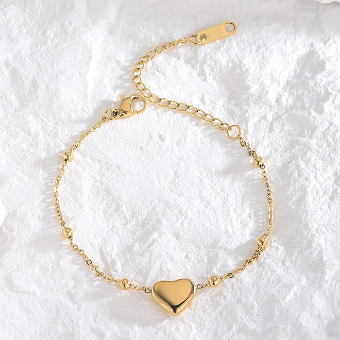 Atacado casual elegante estilo simples formato de coração pulseiras banhadas a ouro 18K de titânio