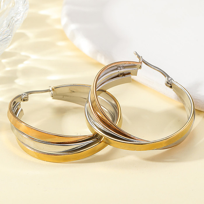 1 Paar schlichte, kunstvolle, runde, polierte Edelstahl-Ohrringe mit 18-Karat-Vergoldung