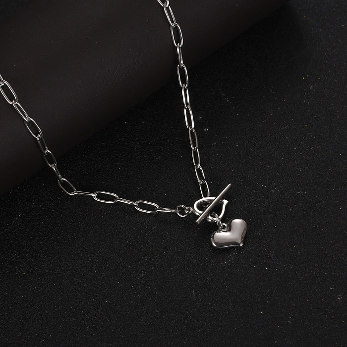 Collier pendentif à bascule en acier inoxydable en forme de coeur doux de style IG