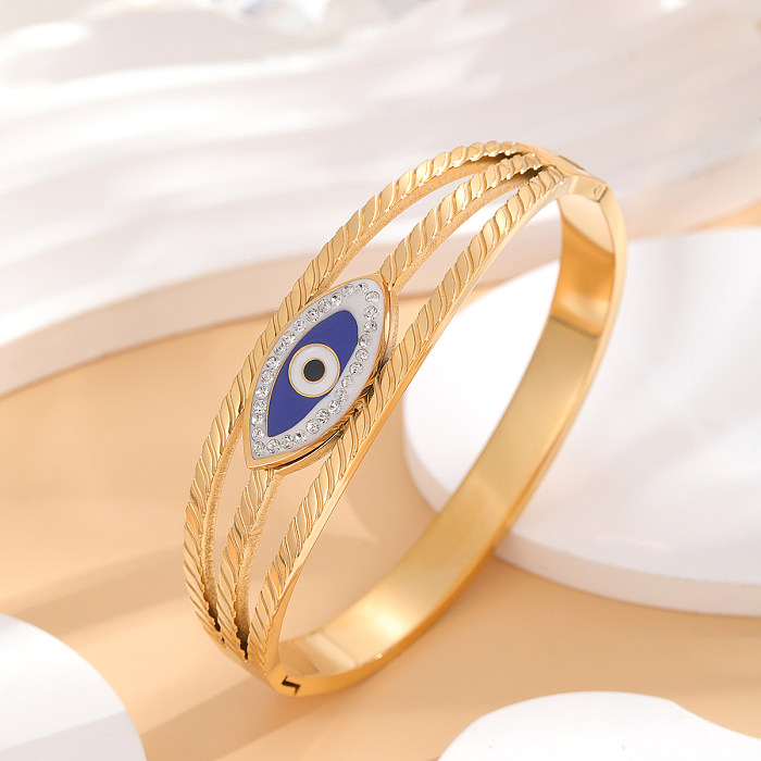 Brazalete chapado en oro de diamantes de imitación con incrustaciones de epoxi de acero de titanio con ojo de estilo francés