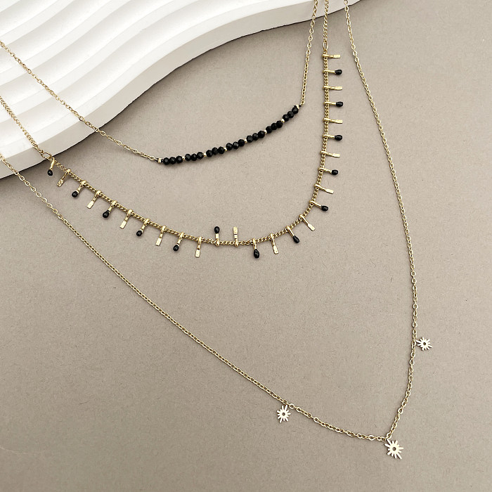 Schlichter Stil mit geometrischem Edelstahl-Inlay, künstlichem Kristall, vergoldet, mehrschichtige Halsketten