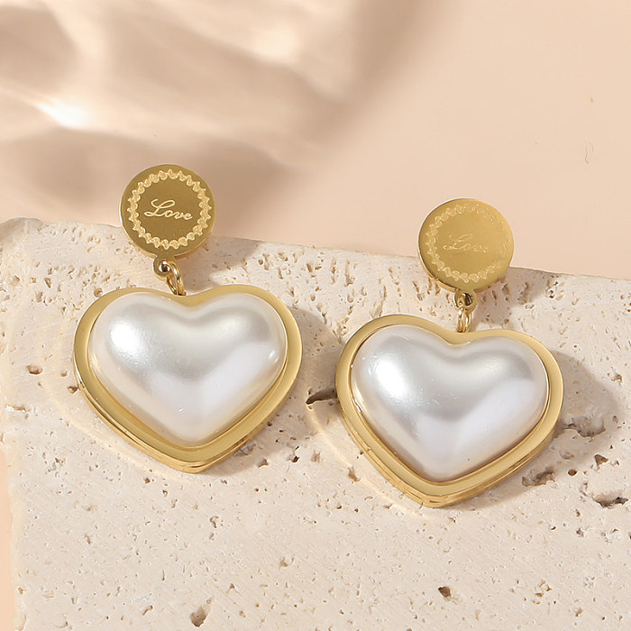 1 paire de boucles d'oreilles pendantes en forme de cœur, Style Simple et décontracté, incrustation en acier inoxydable, acrylique plaqué or 18 carats